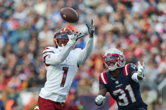 Washington Commanders receiver Jahan Dotson (1) catches a pass for a touchdown during the second half against the New England Patriots at Gillette Stadium.